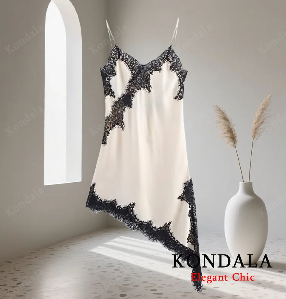 Robe femme élégante en dentelle, coupe asymétrique et col licou.