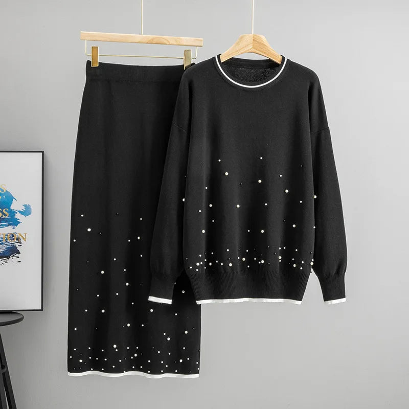 Ensemble tricoté deux pièces pull et longue jupe en maille.